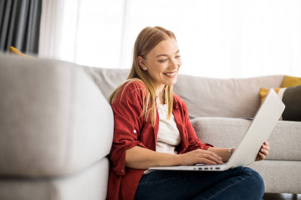 istock Happy young woman working at home. 1328963325
