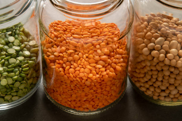 istock Yellow lentil inside a glass jar 1328963366