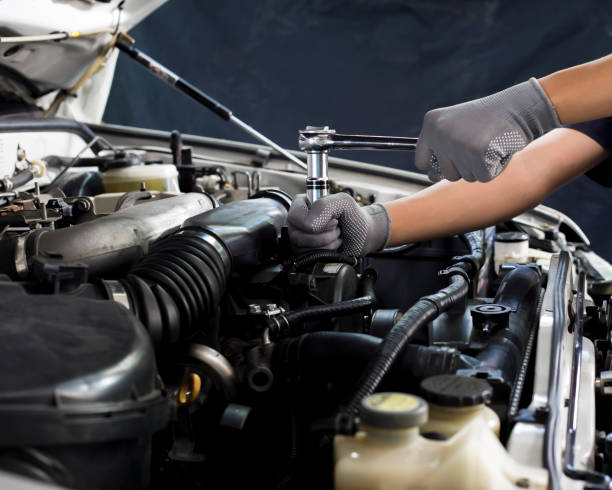 istock Car mechanic working on car engine, car maintenance concept. 1328964342