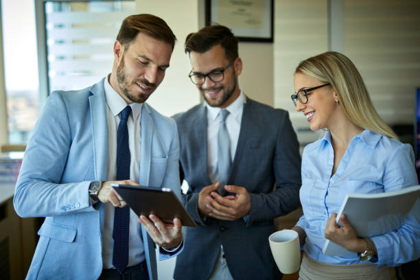 istock Team of colleagues working together in an office 1328971977