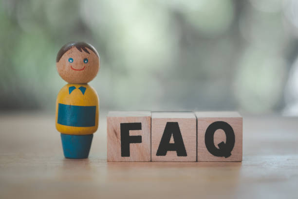 istock Wooden model people and blocks with FAQ text. Information concept 1328980501