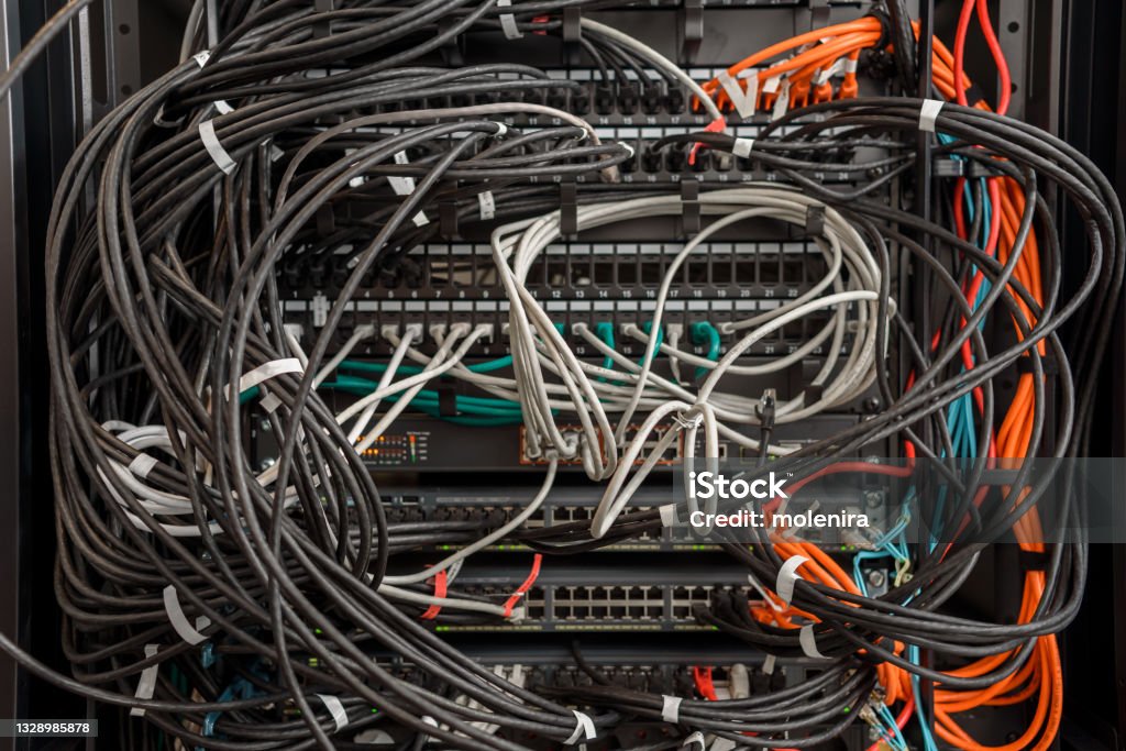 Working hardware in data center Working servers, switches or routers in data center with a lot of cables in a mess and clutter Cable Stock Photo