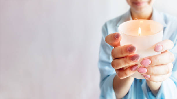 istock Hands are holding a candle. Copy space. Christianity. 1328988388