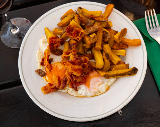 istock Sunny side eggs with baked potatoes and fried bacon 1328990230