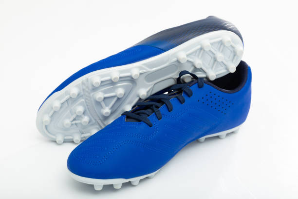 istock Footbal boots. Soccer boots. Isolated on white closeup 1328991059