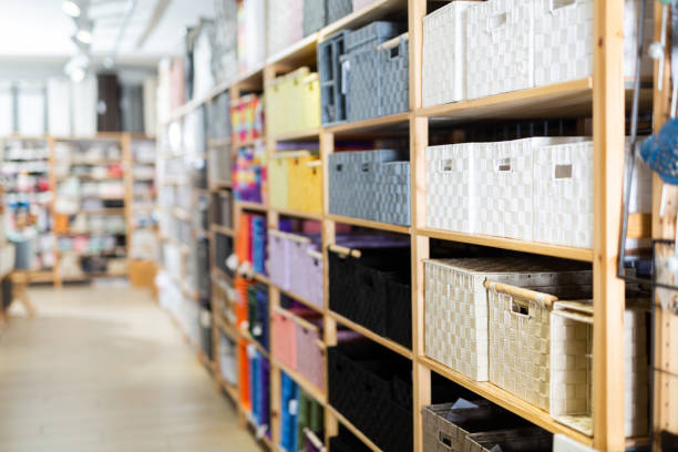 istock Decorative storage boxes on shelving in household goods store 1328991304