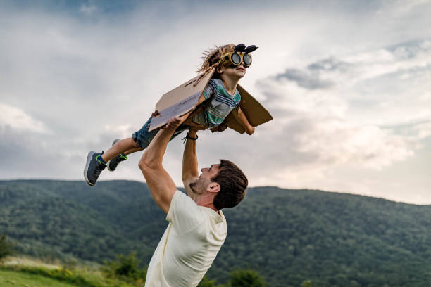 istock Wee daddy, I'm flying like an airplane! 1328991518