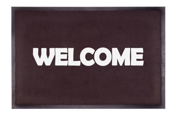 istock Modern black doormat isolated on white - Welcome 1328991750