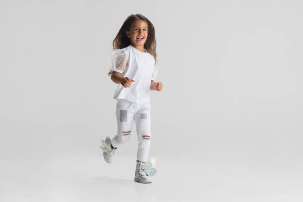 istock One little Caucasian cute girl posing isolated over white studio background. 1328993239