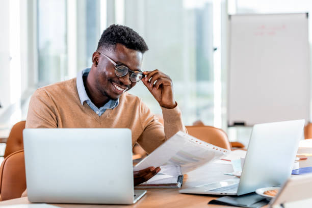 istock Man doing homework and preparing for final exams at university 1329000523