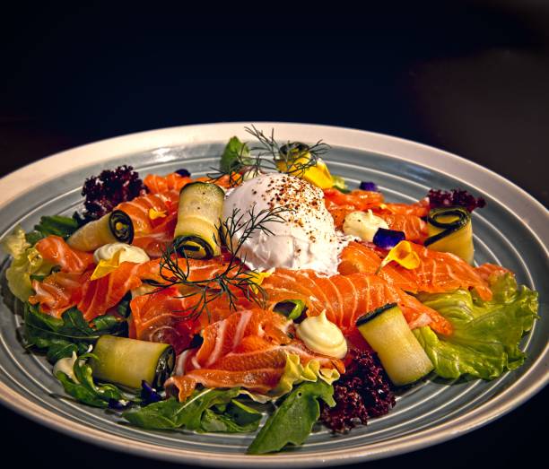 istock Salmon salad with pickled cucumber and poached egg 1329003924
