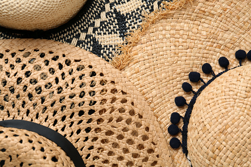 Many different straw hats as background, top view