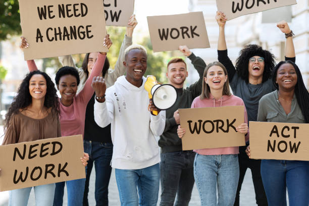 istock Black man leading multiracial group of people protesting against lockdown 1329006523