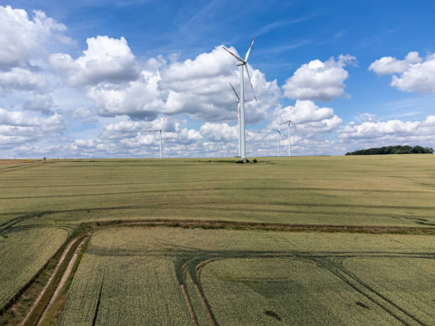 istock Field with a wind turbine in the background