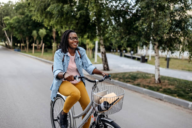istock Young woman going to work with bicycle 1329009301
