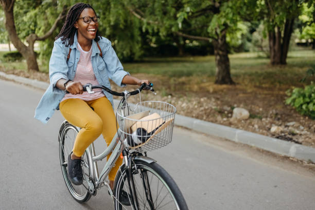 istock Young woman going to work with bicycle 1329010125