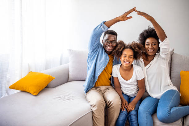 concept of housing and relocation. - family african descent cheerful happiness imagens e fotografias de stock