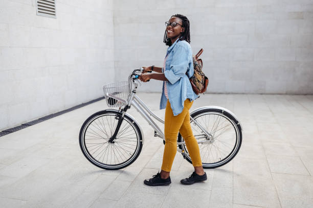 istock Young woman going to work with bicycle 1329010534