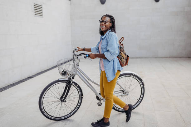 istock Young woman going to work with bicycle 1329010591