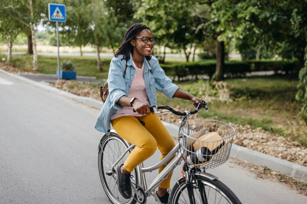 istock Young woman going to work with bicycle 1329010609