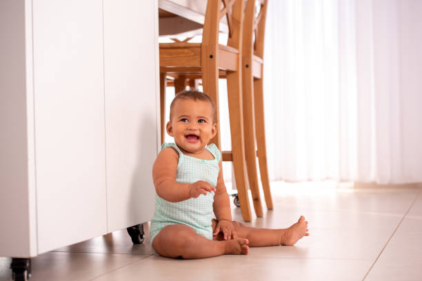 istock Happy baby is sitting on the floor. 1329012771
