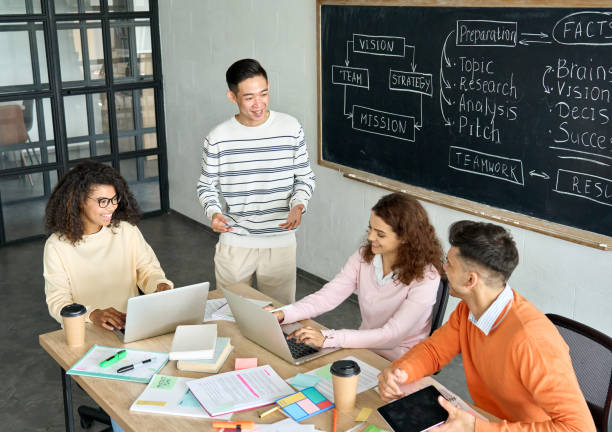 istock Four multiethnic cheerful happy colleagues brainstorming in modern office. 1329013243