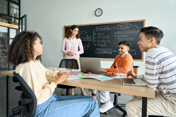 istock Four multiracial cheerful happy colleagues working together in modern office. 1329013266
