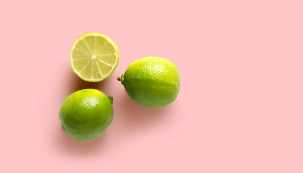 istock high view of fresh lime on pink background with copy space 1329013972