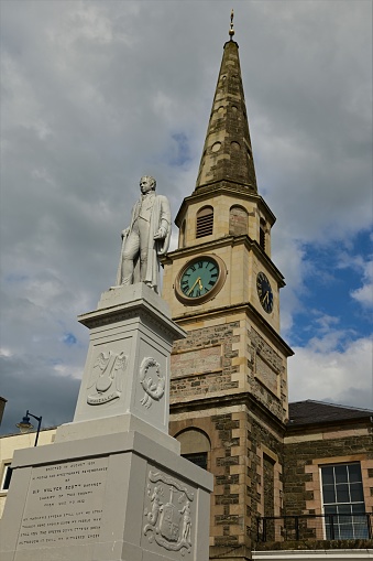 An exterior view of an old stone clock tower building in the Scottish borders town of Selkirk.