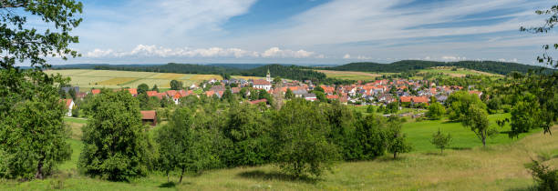 istock Idyllic village panorama in hilly rural landscape 1329015303