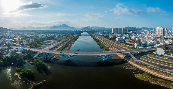 Drone view of Quan Truong river from above in Nha Trang city, with Phong Chau bridge - Khanh Hoa province, central Vietnam