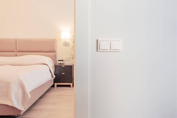Modern bright bedroom interior with lamp swith at the front plan