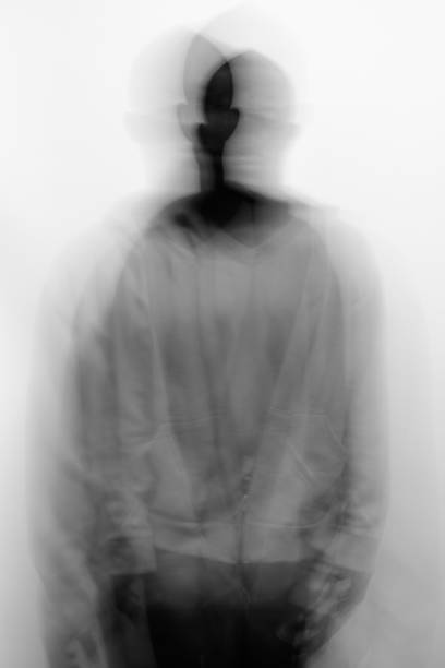 istock Blurred Image Of Man Standing Against White Background 1329019503