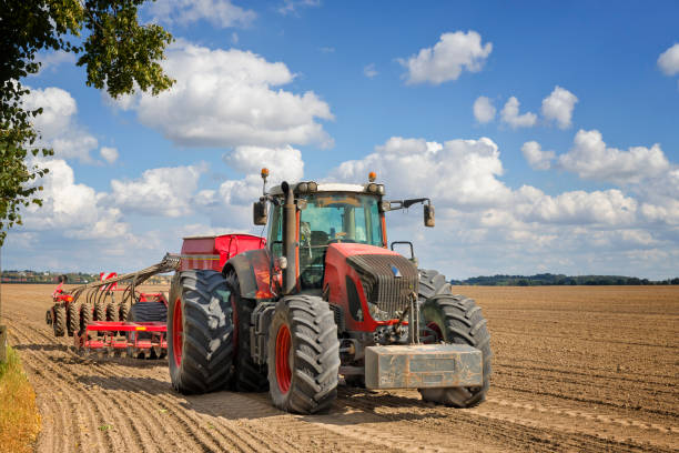 istock Tractor with seeding and plowing machine on the plantation 1329019921
