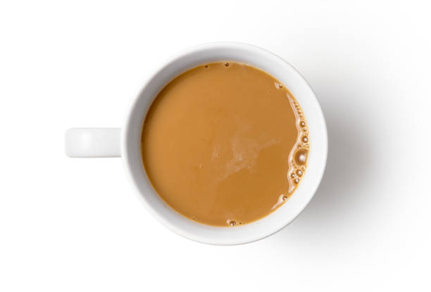 Black coffee in a mug with a jug of milk