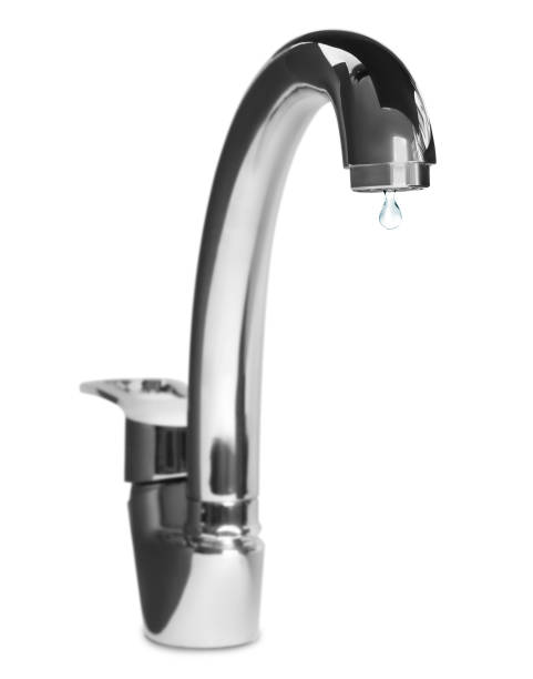istock Water drop flowing from tap on white background 1329020578