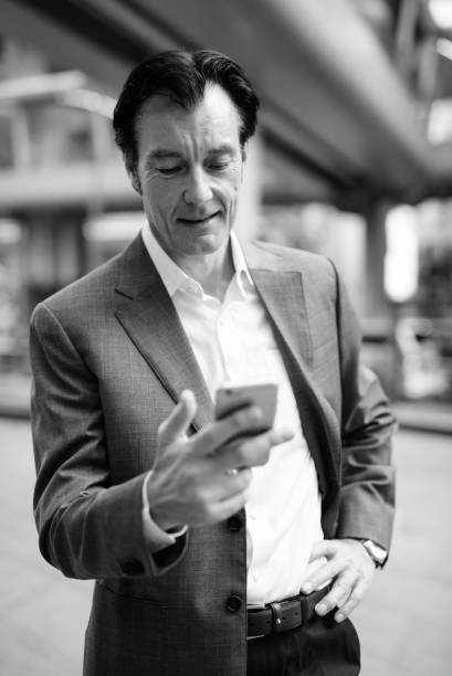 istock Mid Adult Man Using Mobile Phone 1329020758