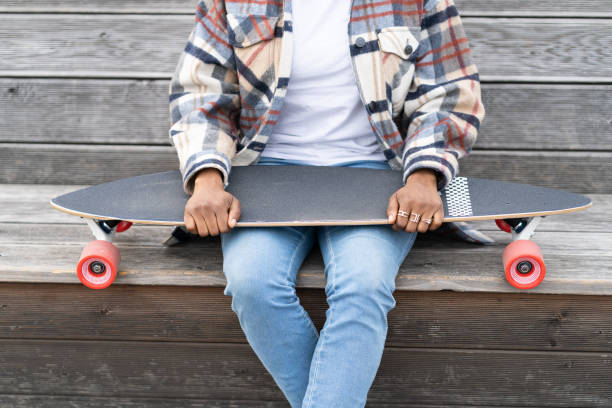 istock Low Section Of Man Sitting On Skateboard 1329021527