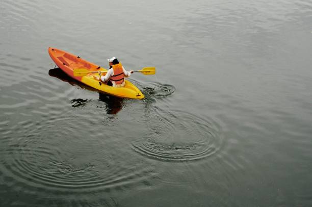istock Woman kayaking in the lake 1329031209