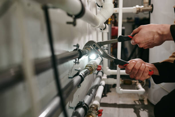 istock Hands of technician or plumber repairing broken pipes 1329032159