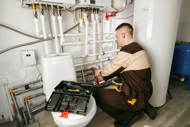 istock Young worker repairing pipes in lavatory 1329032169
