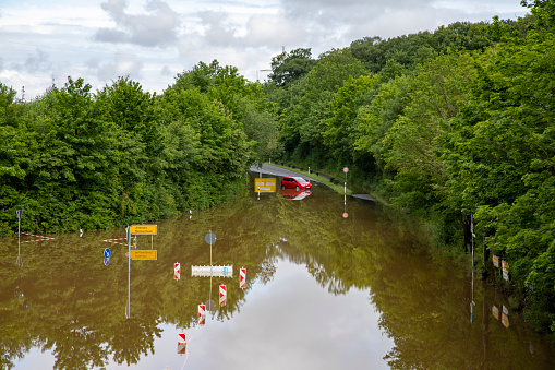 Meckenheim, NRW, Germany, 07 15 2021, street flooded by heavy rain. a car is in the water