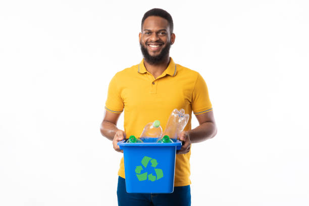 istock African Male Holding Box With Recycle Symbol On White Background 1329036706
