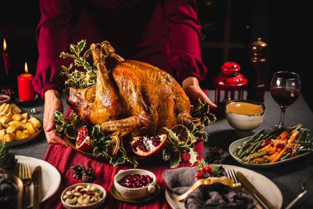 istock Woman serving Christmas turkey 1329036808