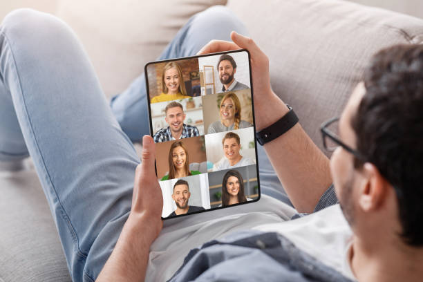 istock Unrecognizable Guy With Digital Tablet Having Group Video Call With Friends 1329036866