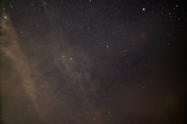 istock Geminids meteor shower and night sky 1329036918