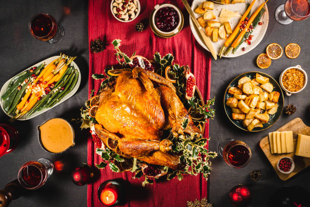 istock Delicious Christmas dinner served with wine 1329036967