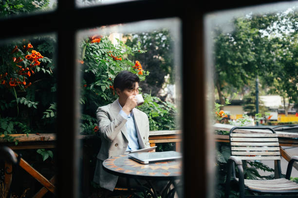 istock Business men working in outdoor cafes 1329038477