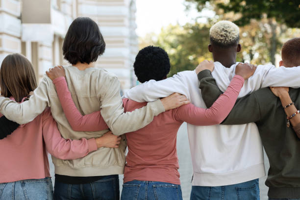 istock Rear view of people making strike on the street, hugging 1329039933