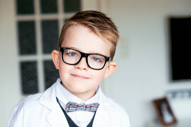 istock Young scientist with glasses wears lab coat and smiles 1329044209